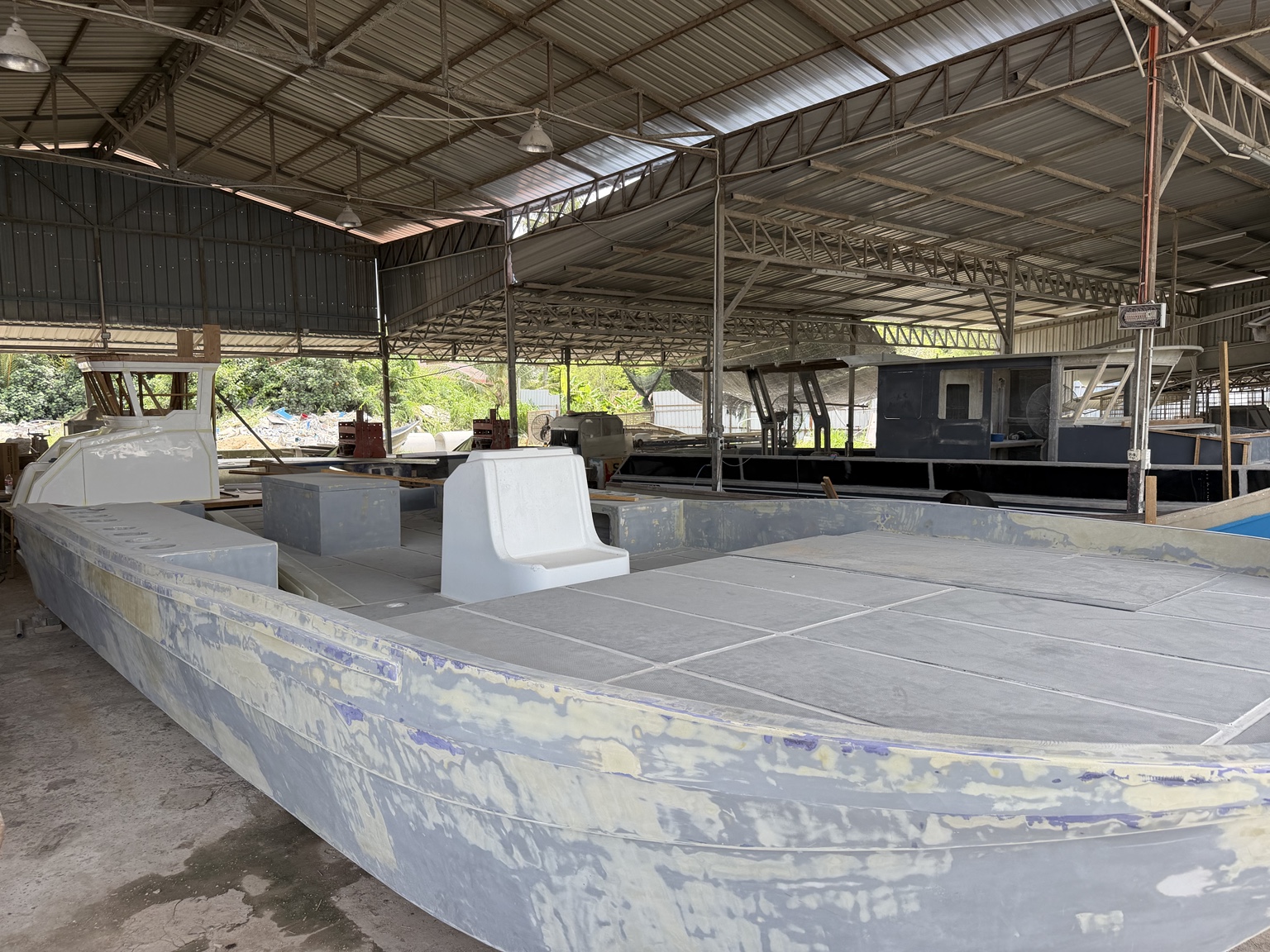 Detailed wide-deck fabrication on a vessel in the yard