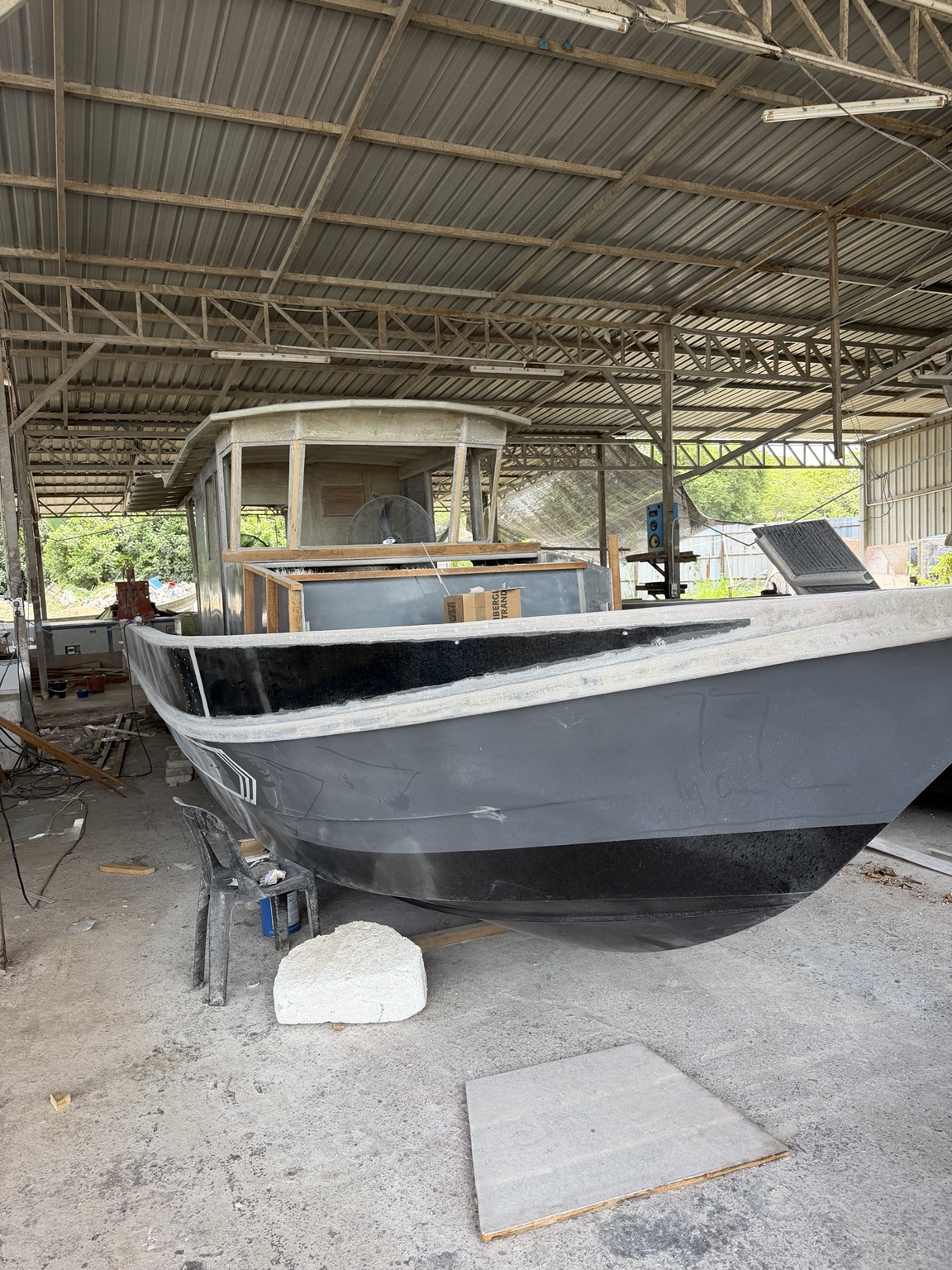 Grey vessel undergoing extensive refit work